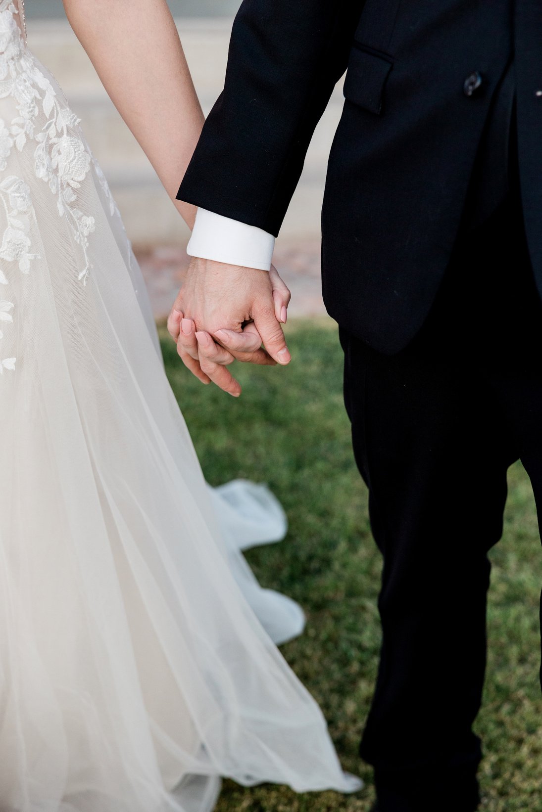 Bride and Groom Holding Hands